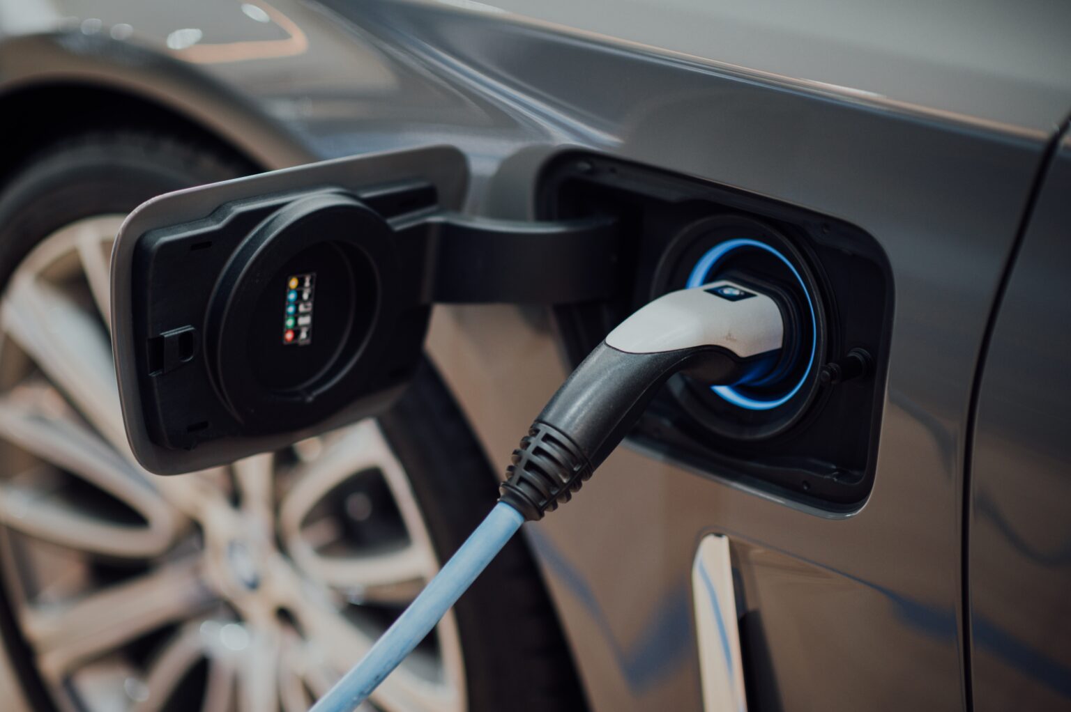 Electric vehicle charging at a charging station in Dubai